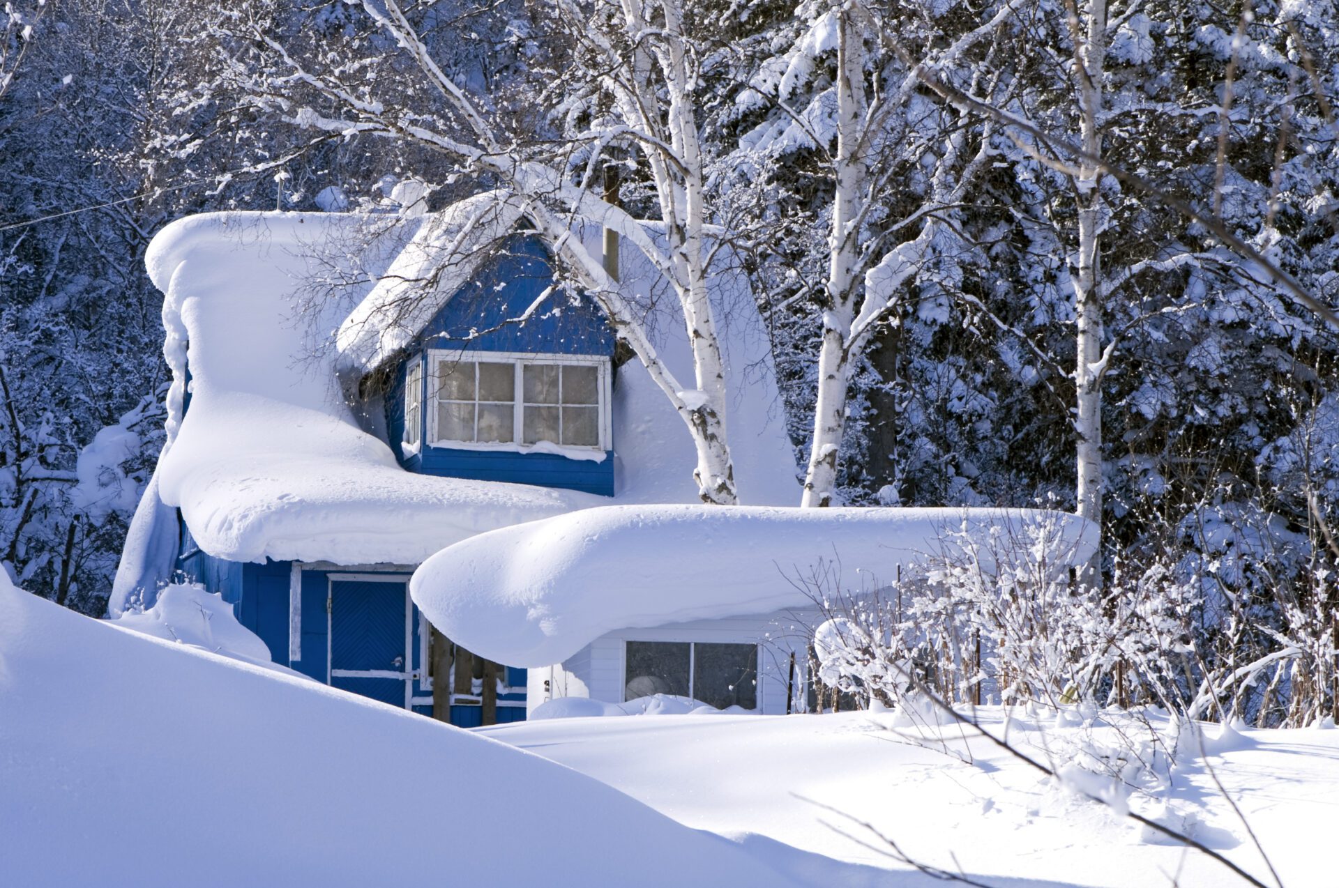 Solid roof holding layers of snow. Roof was recently replaced by Impact Roofing.