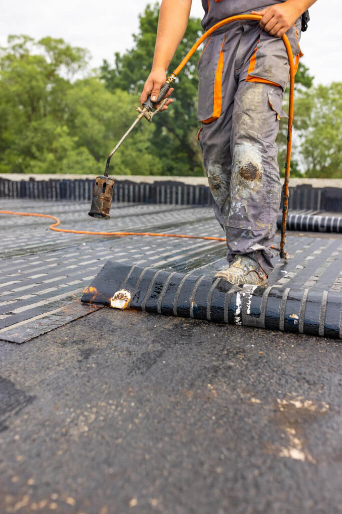 Worker installing roof